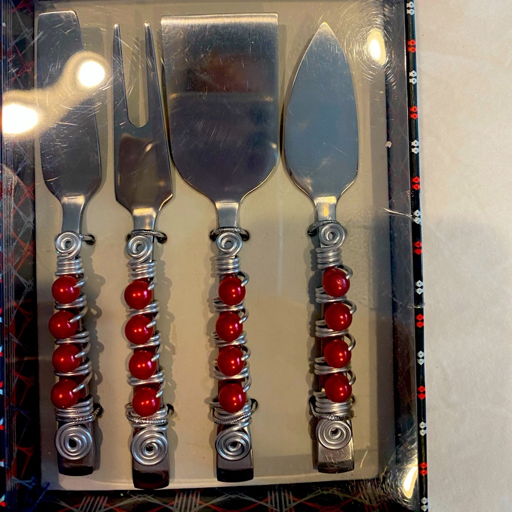 Red accented on silver: cheese knife set